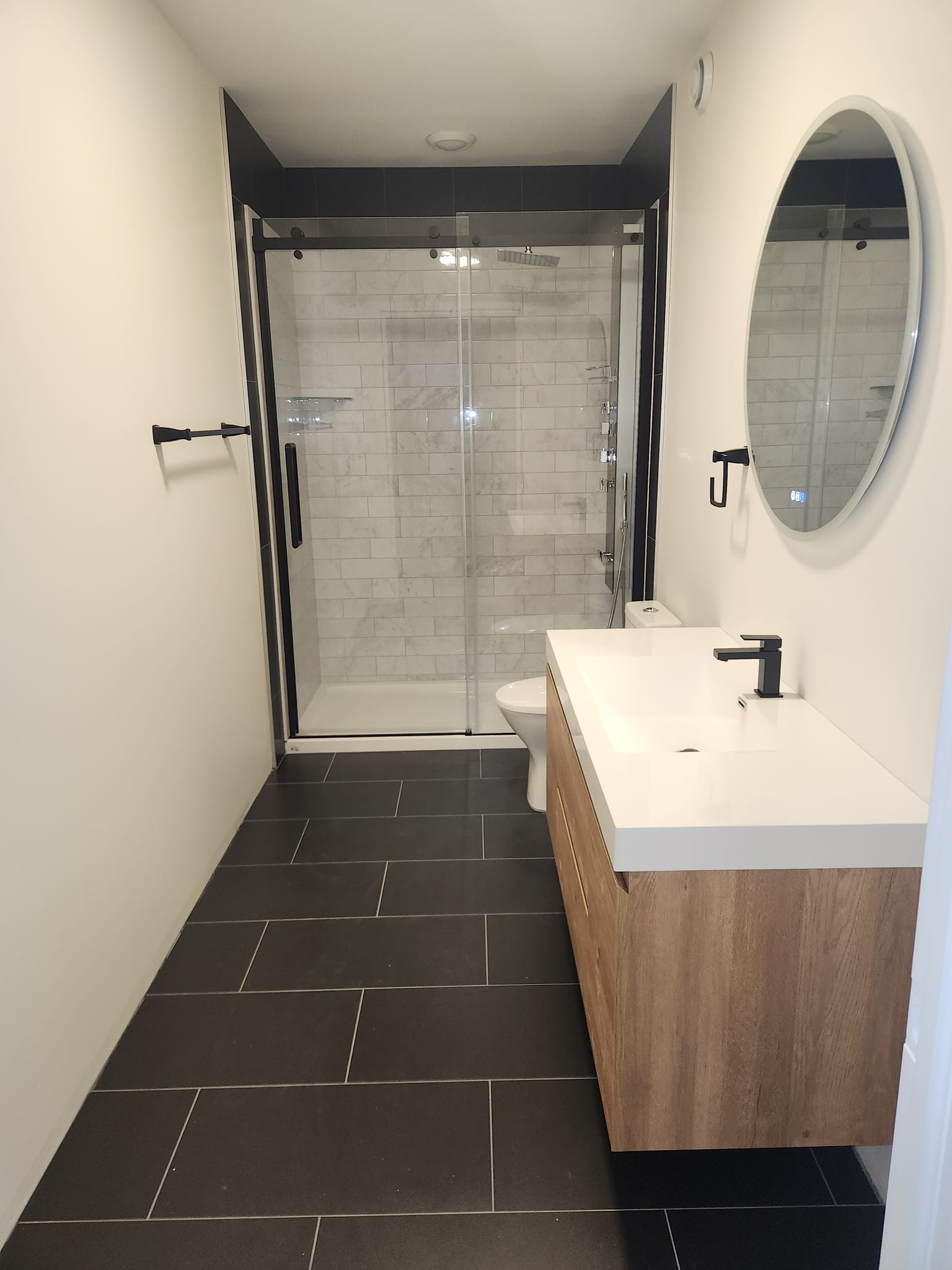 Modern floating vanity and luxury walk-in shower